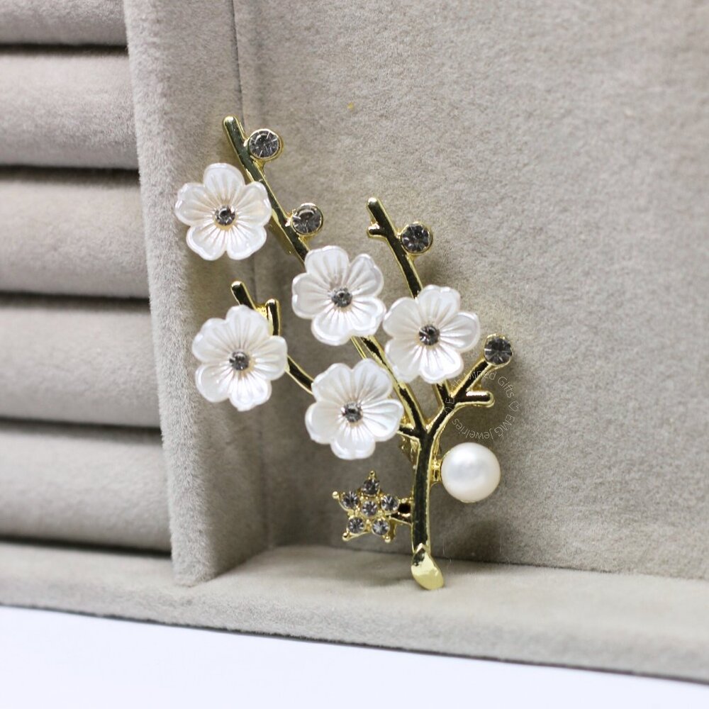 Gold-tone branch with white flowers and pearl accent